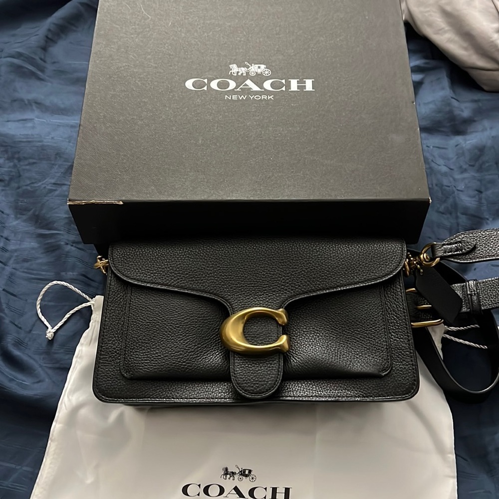 Coach Used 2x pebble leather black hand bag and has adjustable shoulder strap